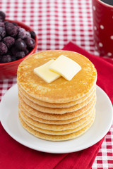 A Stack of Freshly Made Pancakes on a Gingham Tablecloth