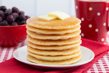 A Stack of Freshly Made Pancakes on a Gingham Tablecloth