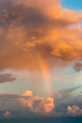 Fototapeta premium Rainbow and fantastic clouds at sunset,,natural composition