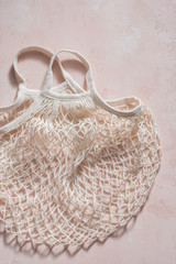 Fototapeta premium Empty reusable shopping bag on pink.