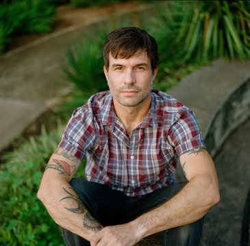 Portrait of a handsome man in a vintage button up shirt