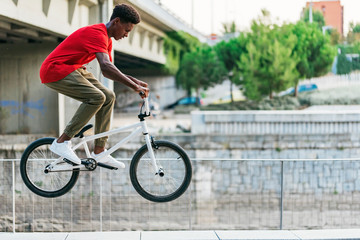 Young man doing stunts on bicycle