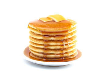 Stack of Freshly Made Pancakes with Syrup and Butter Isoalted on a White Background