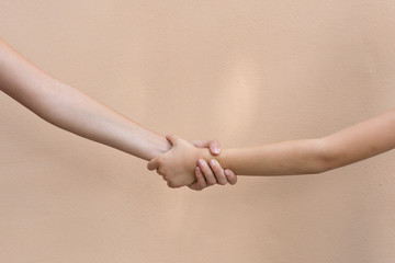 Pair of hands helping each other