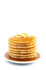 Stack of Freshly Made Pancakes with Syrup and Butter Isoalted on a White Background