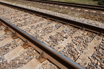 Naklejka premium railway rails close view - abstract background, freight transportation concept