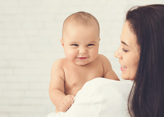 Portrait of angelic baby and his mother
