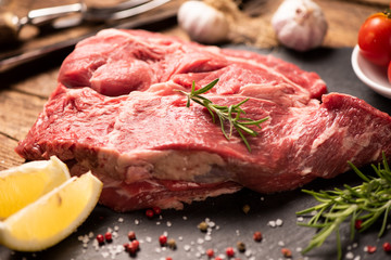 Raw fresh meat on a black cutting board