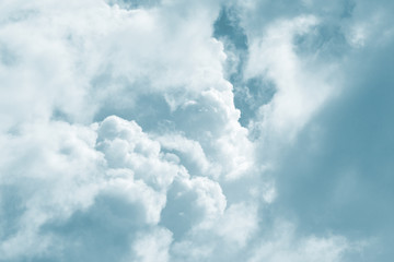 Soft fluffy blue clouds in the sky. Sunlight, light and shadow. natural background