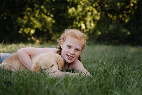 Smiling Girl and Puppy
