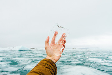 Close up of man's hand holding ice