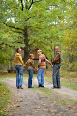 Fototapeta premium Portrait of family of four in park