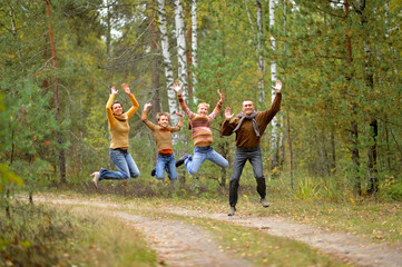 Fototapeta premium Portrait of family of four in park