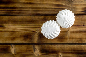 Marshmallow - white zephyr on dark wooden background