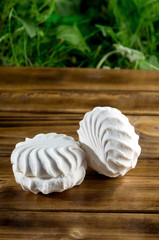 Marshmallow - white zephyr on dark wooden background