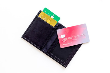 Credit cards in wallet for online payment on white background top view