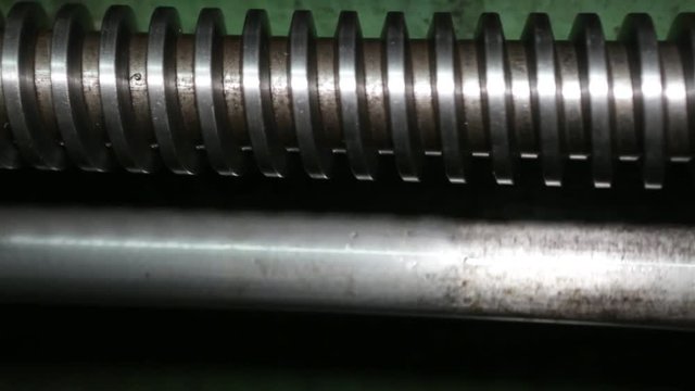 Lathe in action. Old lathe in the lathe shop.The operator of the machine works on an old lathe. Setting up the lathe