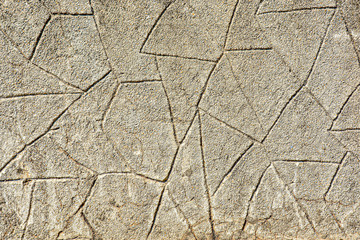 Abstract background imitation of an wall of stone. Texture of brown concrete masonry.