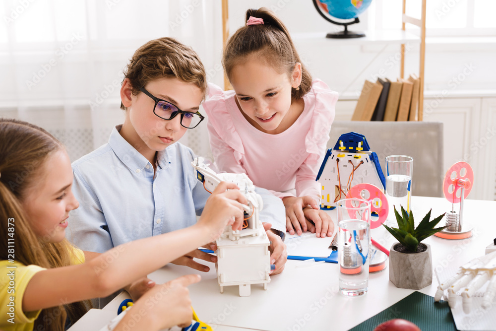 Poster stem education. kids creating robots at school