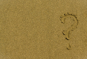 Fototapeta na wymiar Question mark on the sand