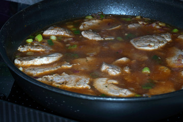 Pork tenderloin stewed in medaillons with vegetables and spices