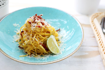 Traditional Italian cuisine, spaghetti carbonara with creamy sauce, bacon and parmesan cheese
