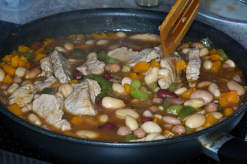 Canned white giant beans cooked in a pan with macro lens photographed