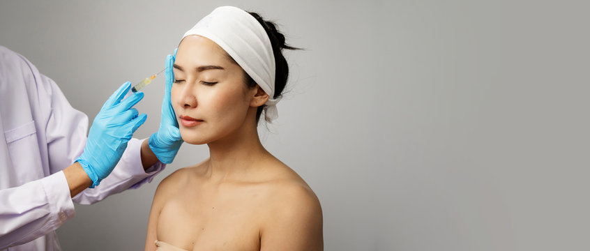 Treatment with botox concept, Asian Woman receiving Botox injection