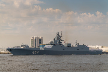 Military frigate runs along Kronstadt during the celebration of the Day of the Navy. 28 July 2019.