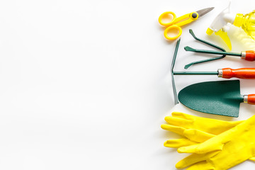 Gardening tools on white background top view copyspace