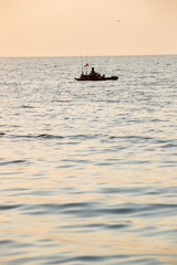 Young Man Kayak Fishing at Sunrise in Canada