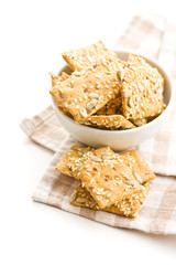 Salted crispy crackers with sesame and sunflower seeds