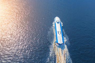 Aerial view luxury passenger motor boat rushing fast.