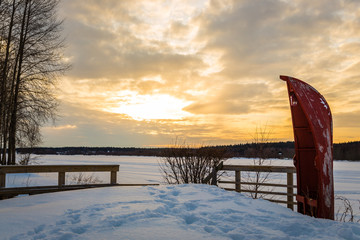 Red canoe waiting for the summer
