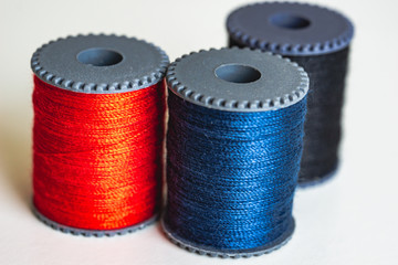 Sewing threads as a multicolored background close up