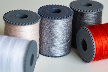 Sewing threads as a multicolored background close up