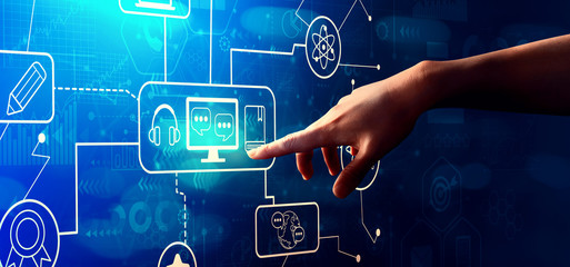 E-Learning with hand pressing a button on a technology screen