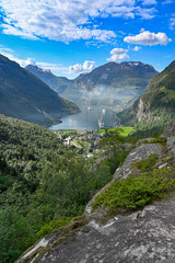 Naklejka na ściany i meble overlooking the town and fjord of Geiranger