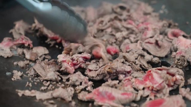 Red beef meat bbq fry  Philadelphia cheesesteak beefsteak top round pan close-up