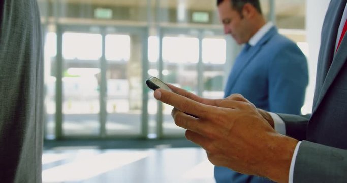 Businessman using mobile phone in a modern office 4k