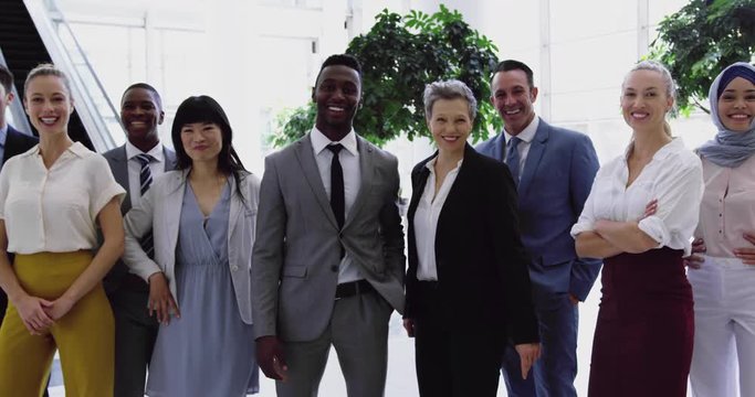 Business people standing together in the lobby at office 4k