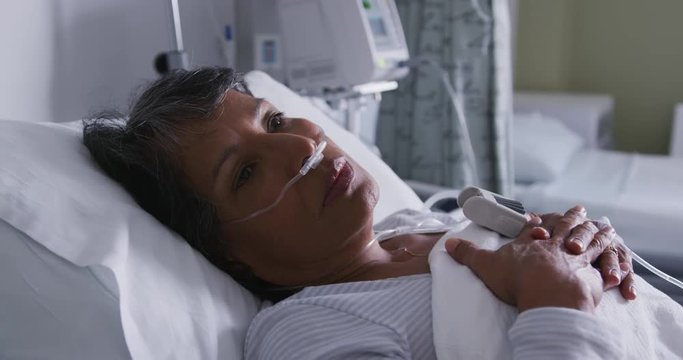 Woman resting in a hospital bed 4k