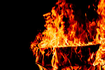 Fire on a dark background. Background from fire. Fire close up. Background for designers.Wood fire...