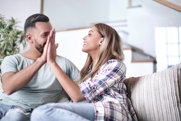 young couple giving each other a high five