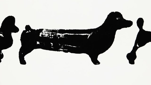 Black silhouettes of dachshund and poodle on the white background, graphic arts