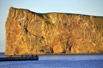 Perce Rock (French rocher Perce, "pierced rock") is a huge sheer rock formation in the Gulf of Saint Lawrence on the tip of the Gaspe Peninsula in Quebec, Canada, off Perce Bay