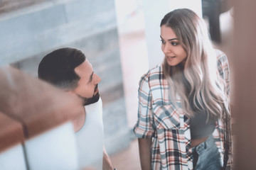 happy couple on the stairs in their new apartment.