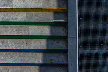 Colorful concrete stairs painted in colors of rainbow