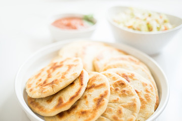 Pupusas from El Salvador with delicious salsa and curtido