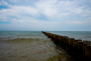wooden groynes at fischland-darß-zingst peninsula, baltic sea, germany